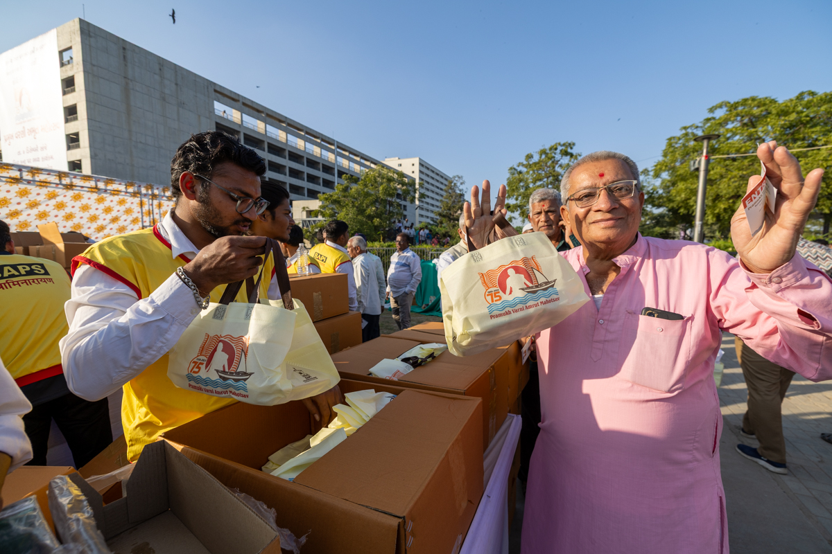 Devotees receive food packets