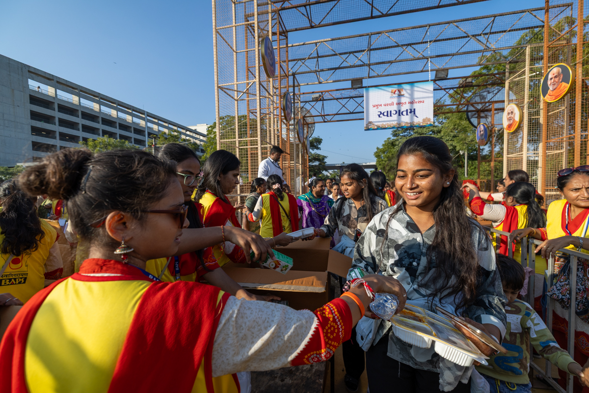 Devotees receive food packets