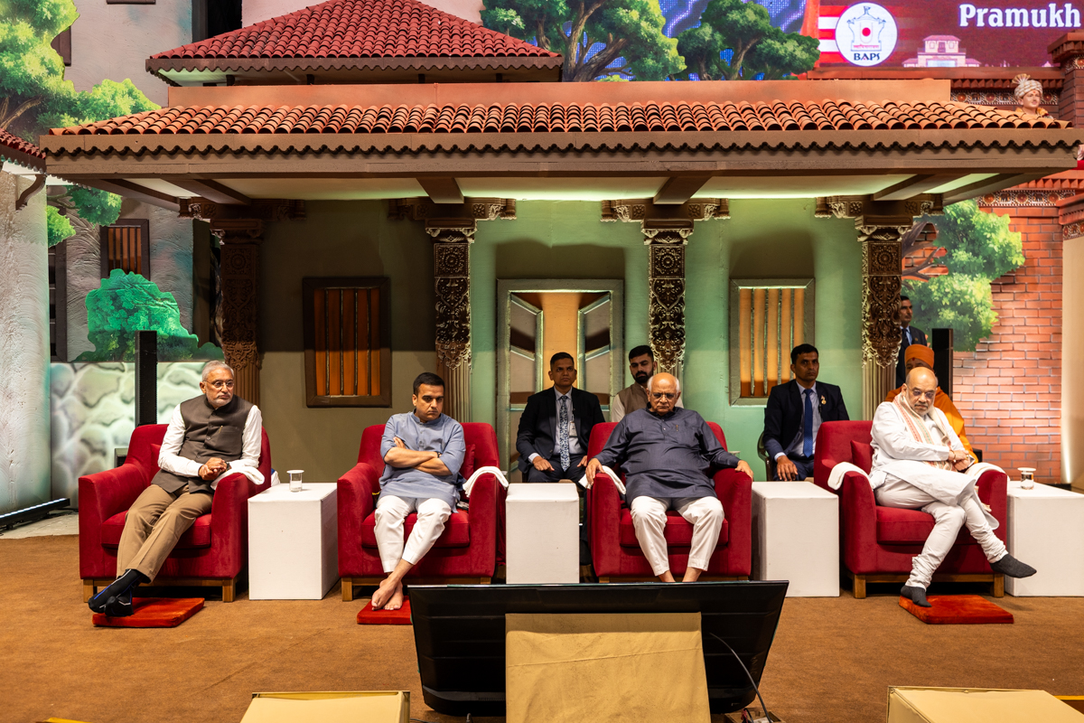 Dignitaries on the stage during the assembly