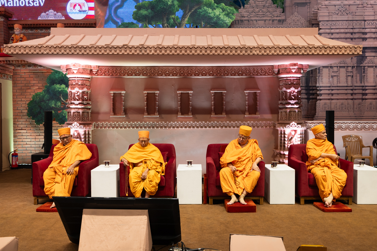 Senior swamis on the stage during the assembly