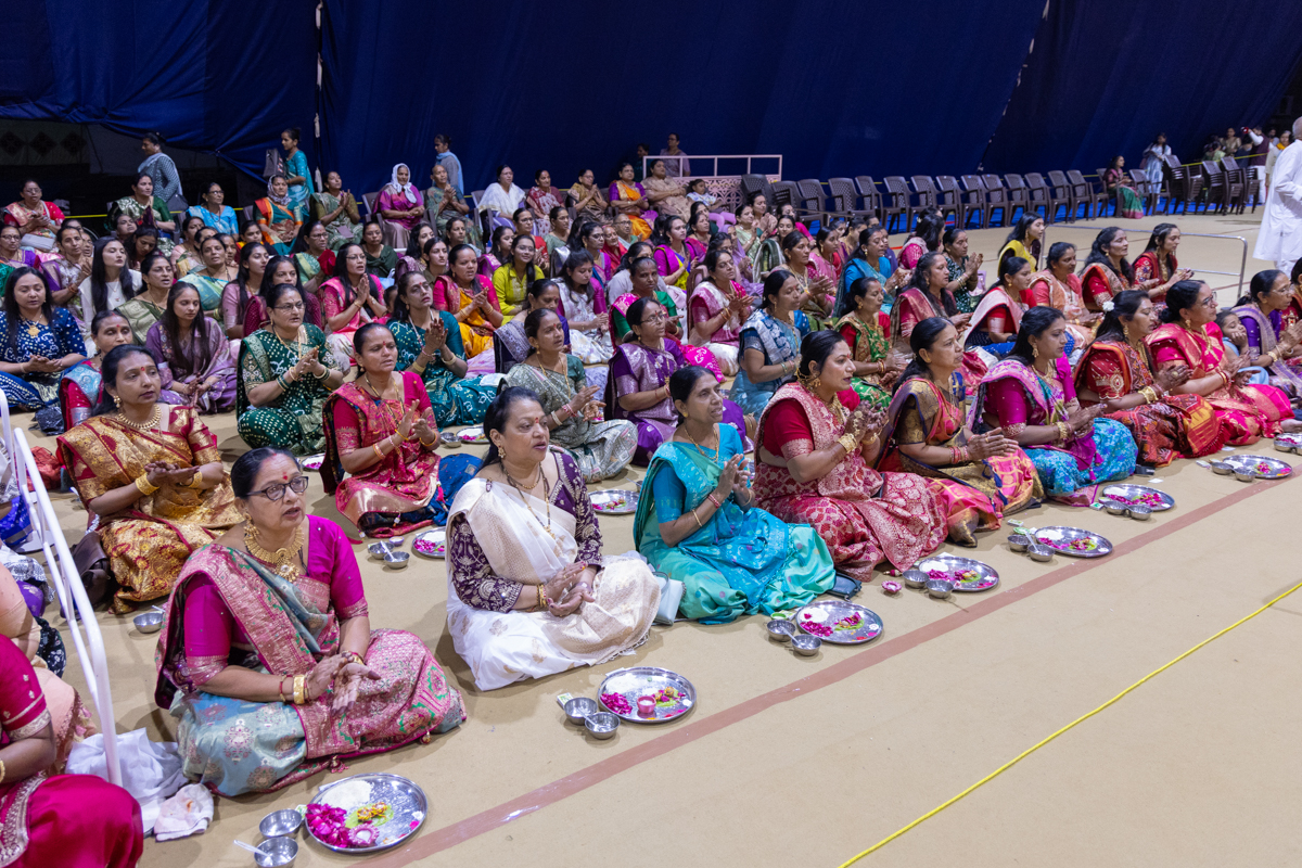 Mothers of sadhaks perform the mahapuja rituals