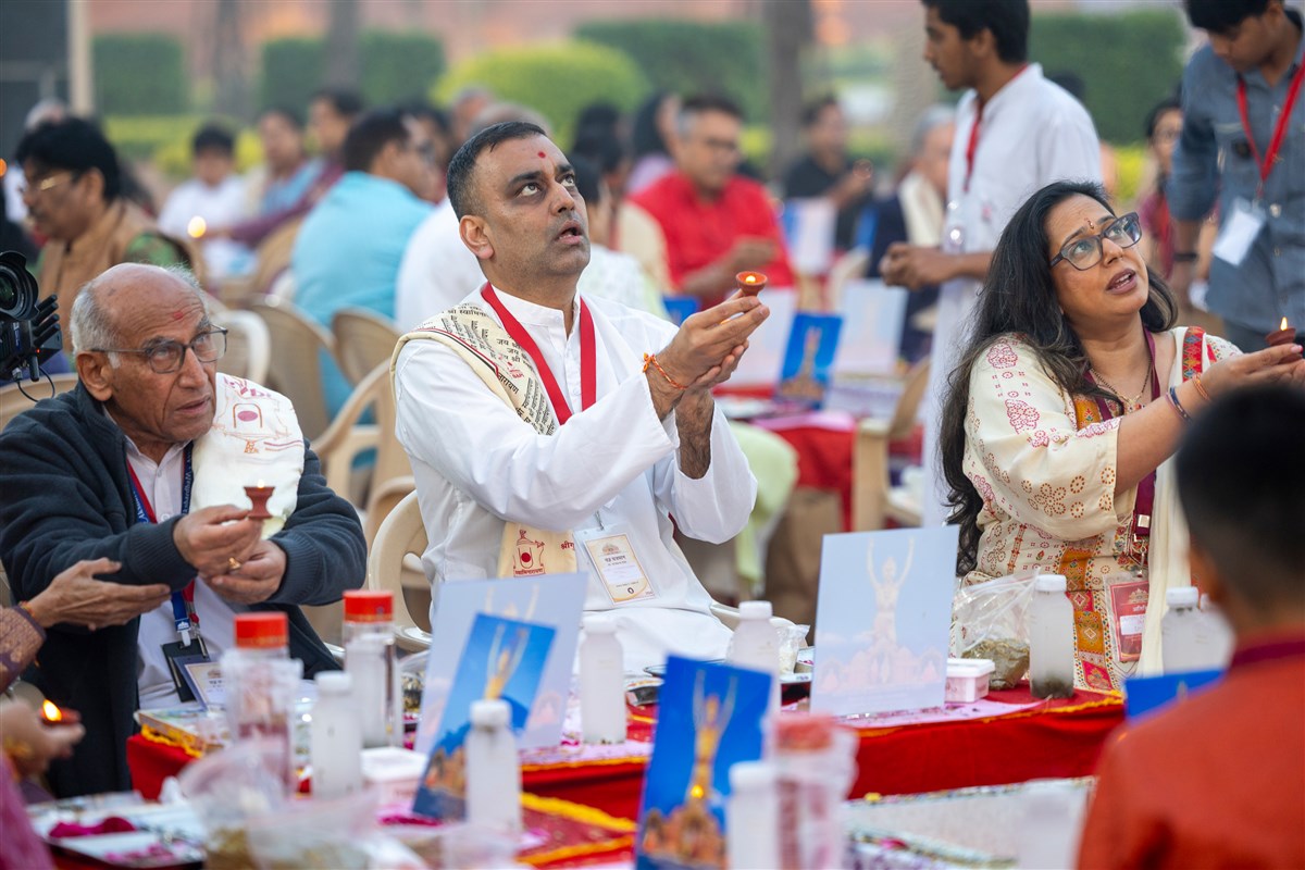 Devotees perform the arti