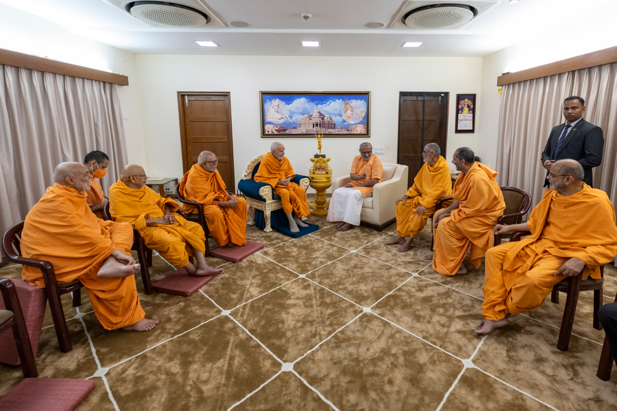 Swamishri and senior swamis in conversation Shri C.P. Radhakrishnan
