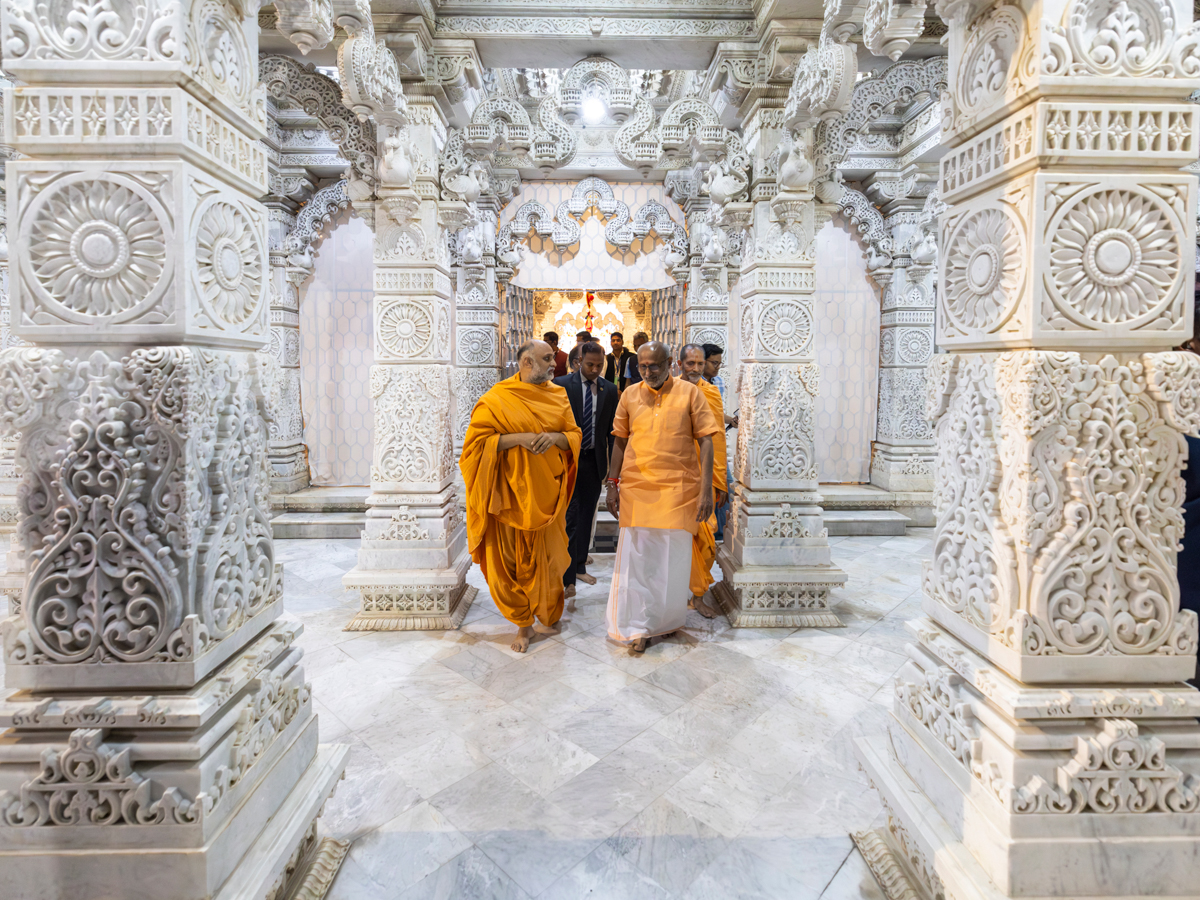 Shri C.P. Radhakrishnan with swamis in the mandir pradakshina