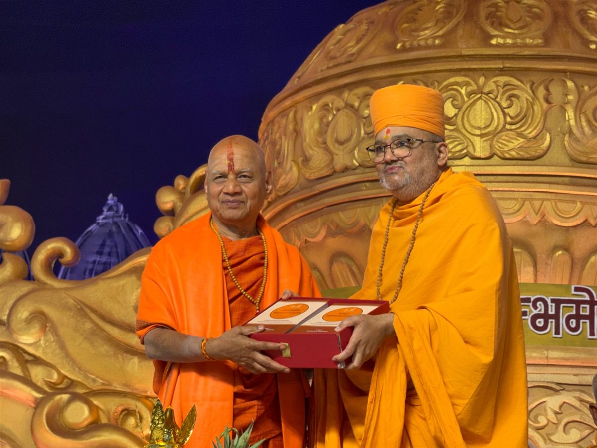Bhadresh Swami offers Akshar-Purushottam Swaminarayan Bhashya to Swami Govind Dev Giri Maharaj 