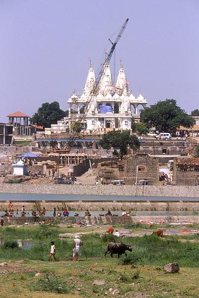 Mandir and construction project with Akshar Ghat in the foreground