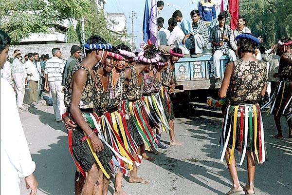 Tribal devotees perform a traditional dance