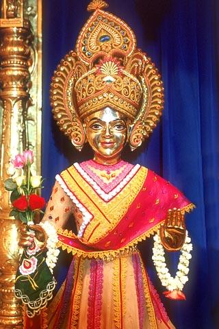 Shri Harikrishna Maharaj beautifully decorated with chandan, lace and ornaments