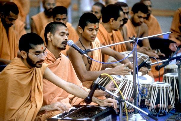 Singing of bhajans with instruments enhances the spirit of devotion