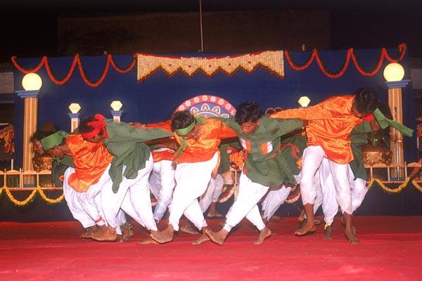 Tribal devotees perform a traditional tribal dance during the public assembly