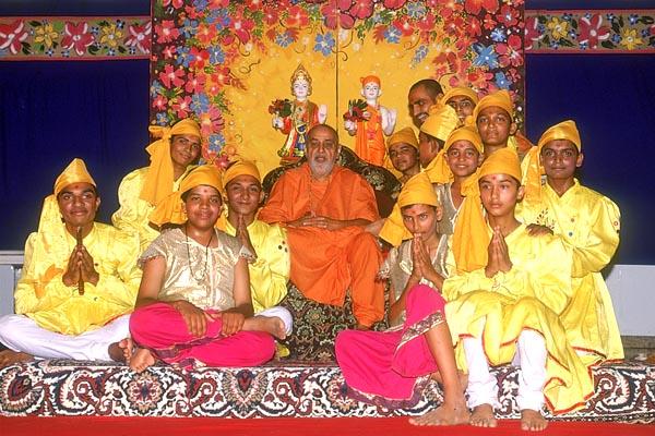 Kishores with Swamishri after a cultural dance performance