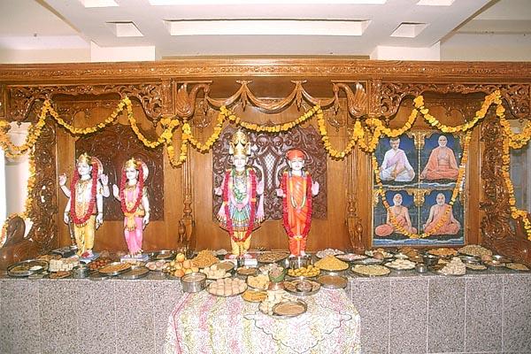 Annakut is offered to the newly consecrated murtis