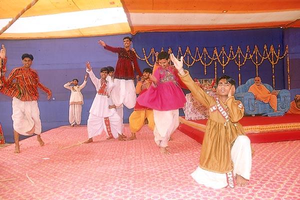 Youths perform a traditional dance 