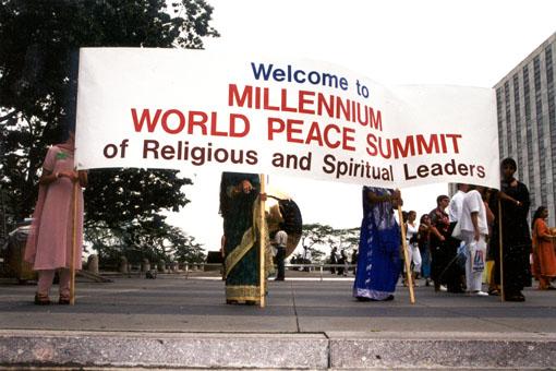  BAPS volunteers with a Welcome banner for the delegates at the United Nations building