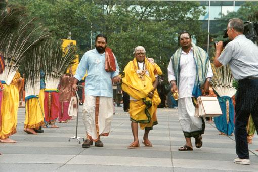 Hindu spiritual leaders being welcomed by a traditional Peacock Dance by BAPS children