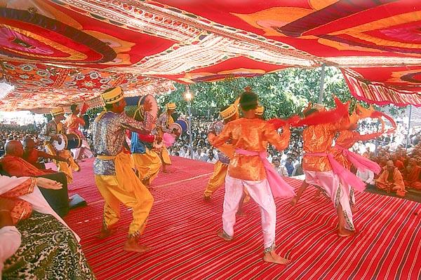 Kishores perform a folk-dance during a satsang assembly on Punam