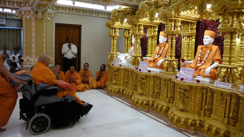 Swamishri engaged in darshan of Guru Parampara