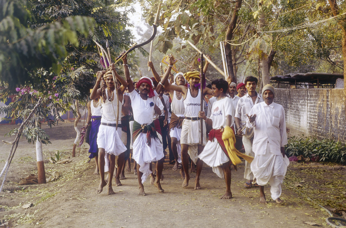 Tribal devotees perform a tribal dance