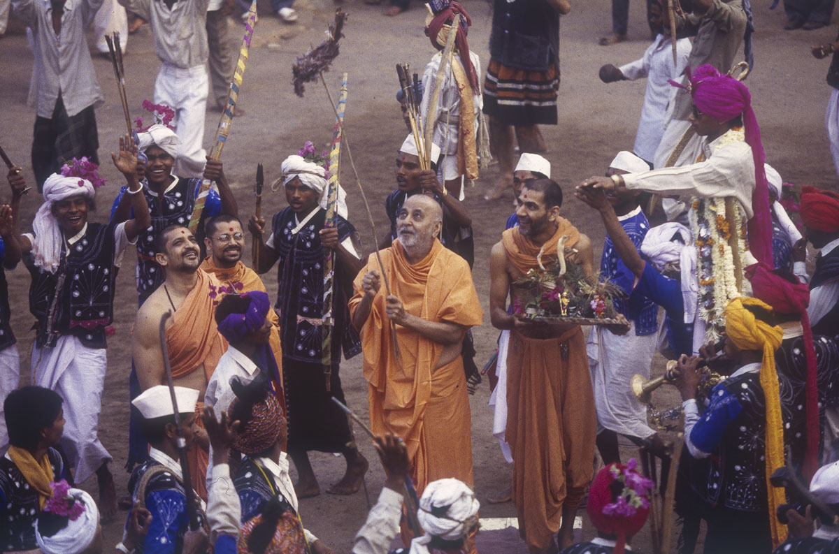 Tribal devotees perform a tribal dance