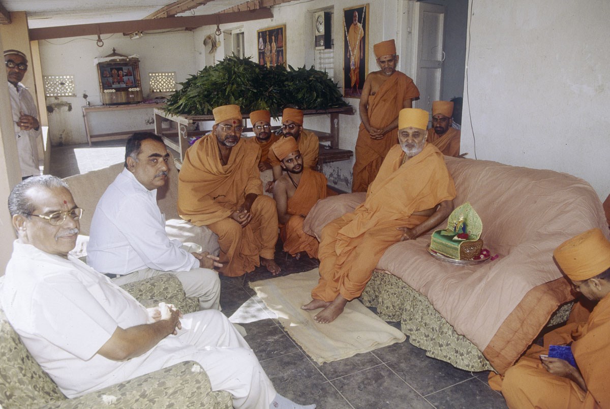 Swamishri and sadhus visit a home of a devotee