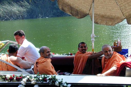 Shri Harikrishna Maharaj, Lord Ganeshji, Swamishri and sadhus taking the traditional boat ride.