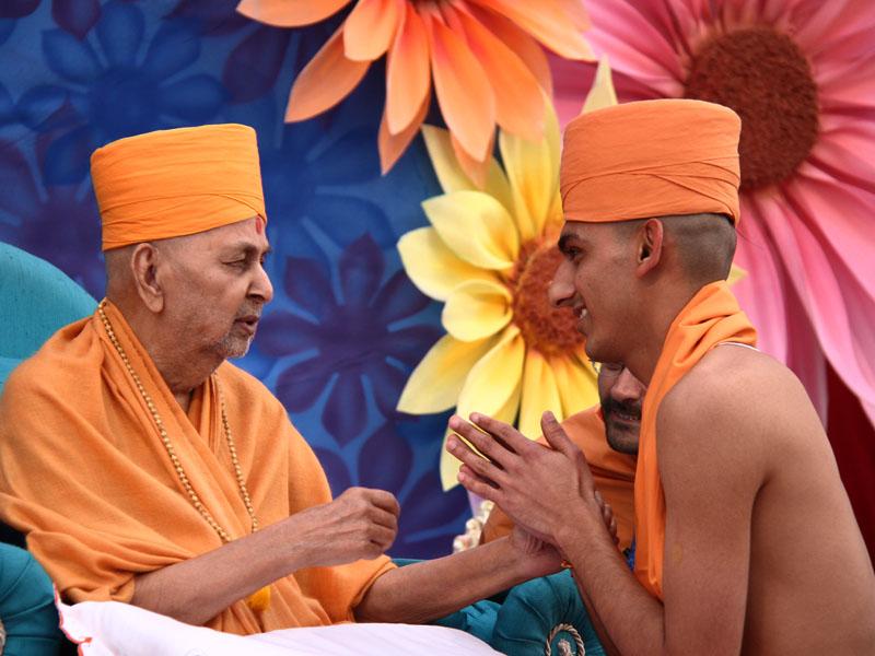  Swamishri gives diksha mantra to sadhus