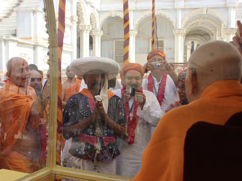  Swamishri blesses a tribal devotee