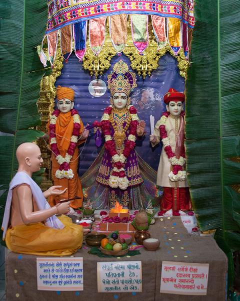  Bhagwan Swaminarayan, Aksharbrahman Gunatitanand Swami and Shri Gopalanand Swami. The murtis and sinhasan are adorned specially for Posh Sud Punam, diksha day of Aksharbrahman Gunatitanand Swami.