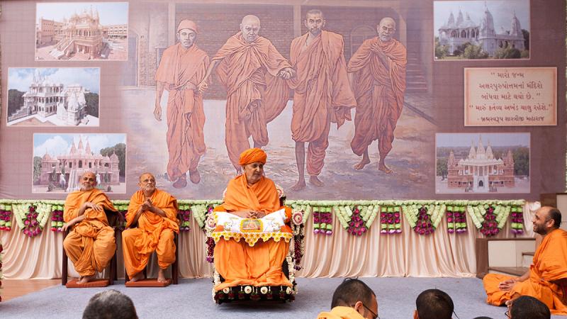  Swamishri and senior sadhus on stage during the satsang assembly