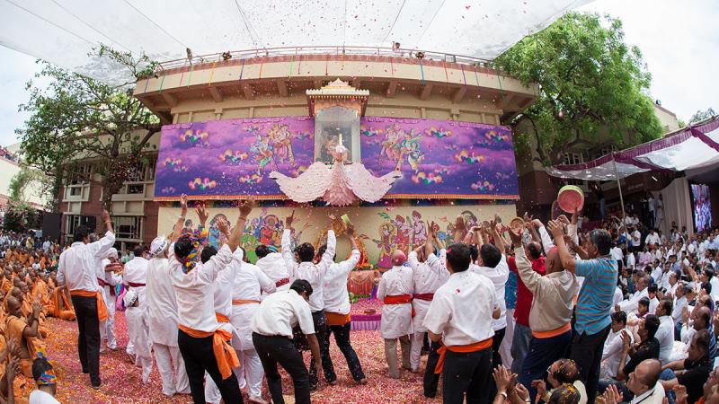  Youth enjoy the celebrations with flower petals and rejoice in the presence of Swamishri