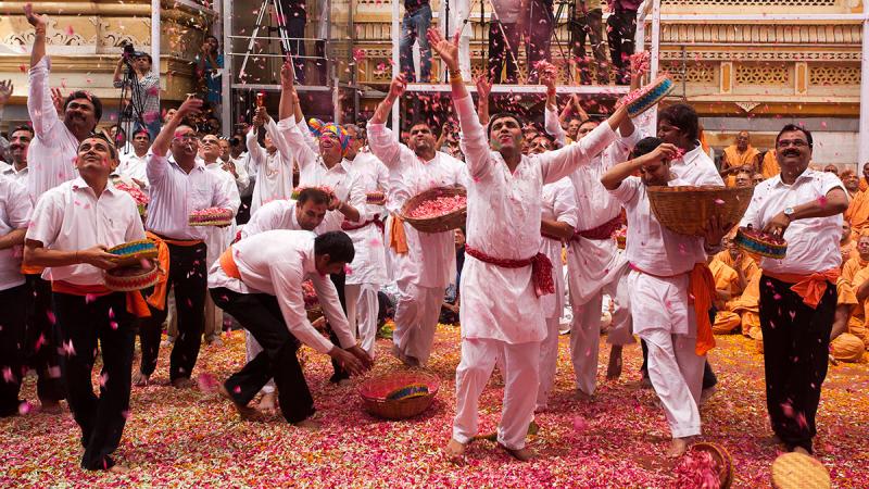  Youth enjoy the celebrations with flower petals in the presence of Swamishri