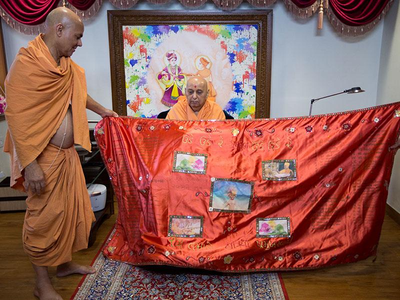  Swamishri is honored with shawls