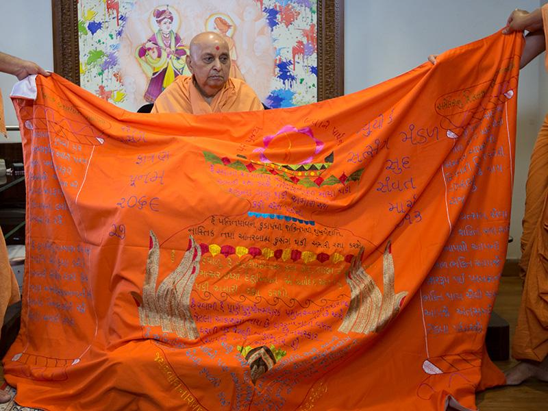  Swamishri is honored with shawls