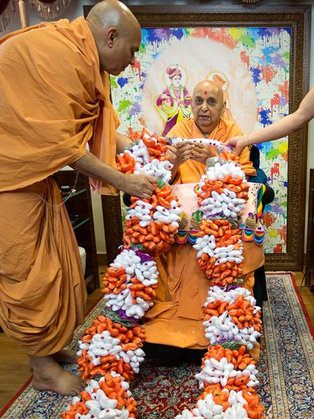 Swamishri is honored with garlands