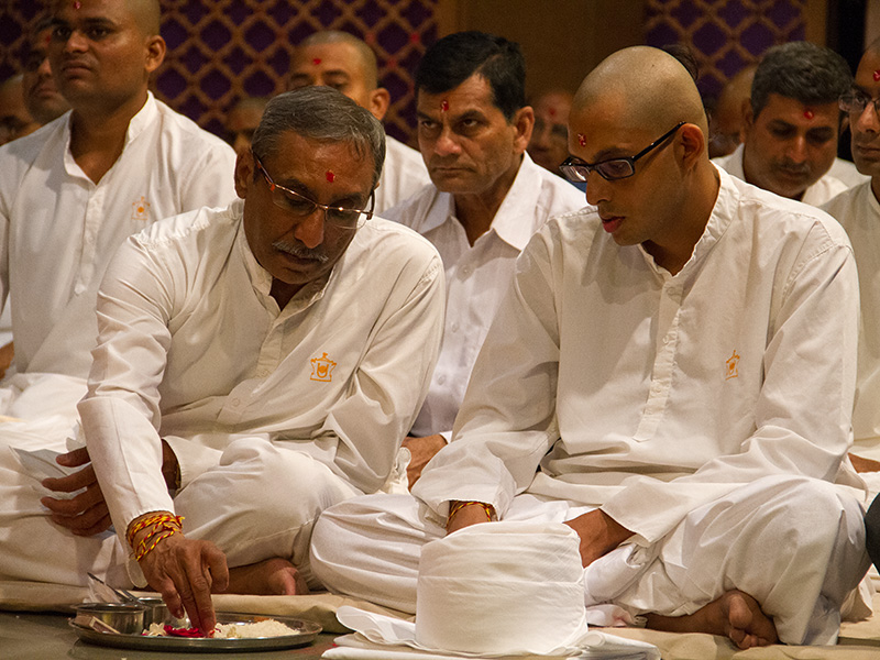 Sadhaks and their fathers perform mahapuja rituals