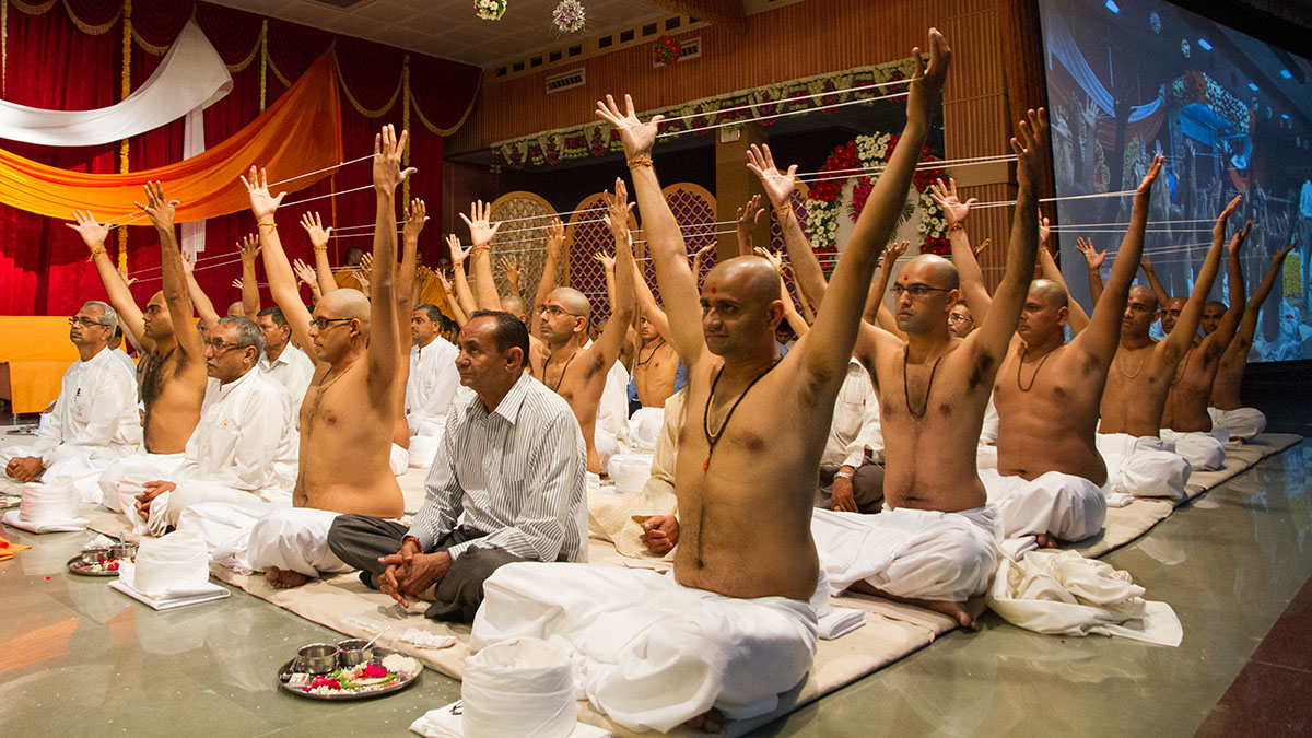 Sadhaks and their fathers perform mahapuja ritual