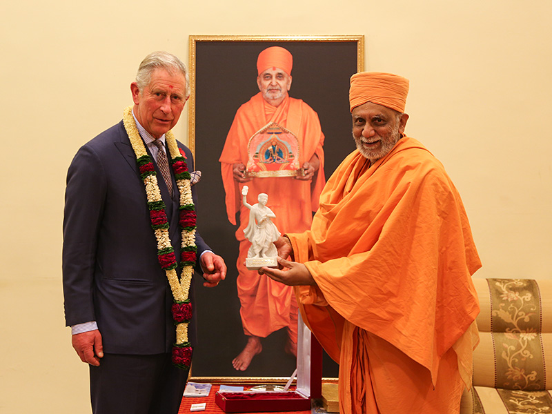 HRH the Prince of Wales is presented with a memento on his visit by Atmaswarup Swami