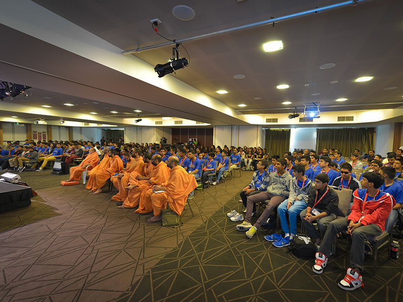 Sadhus and delegates enjoying the convention session