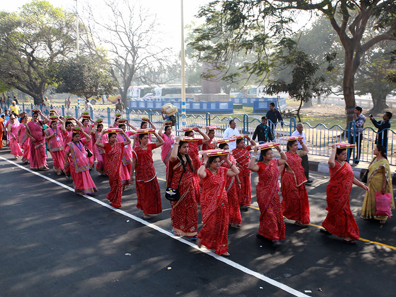 Nagar Yatra - women carrying 'pothi' - scripture - participate in the procession