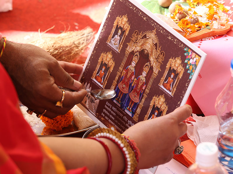 Families perform yagna rituals
