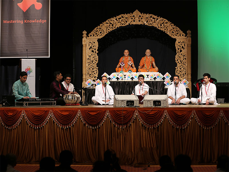 Youths sing kirtans at the ceremony