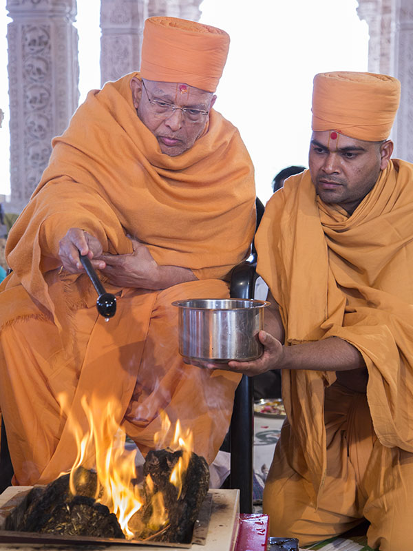 Vastu - Mandir Pravesh rituals being conducted by Ghanshyamcharan Swami