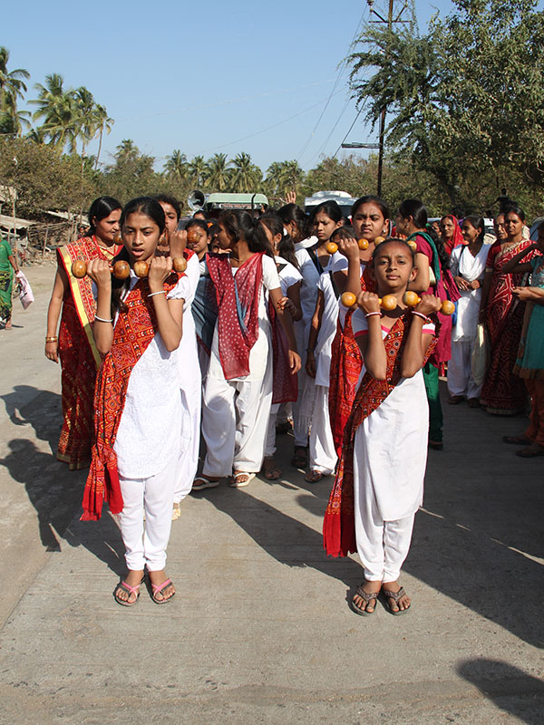 Girls participate in the procession