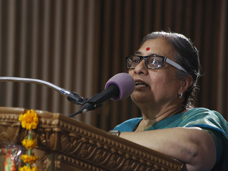 Women devotees address the assembly