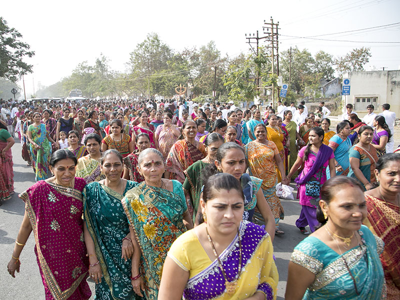 Women devotees participate in the procession