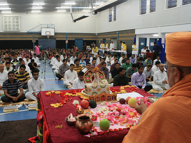 Devotees participate in mahapuja