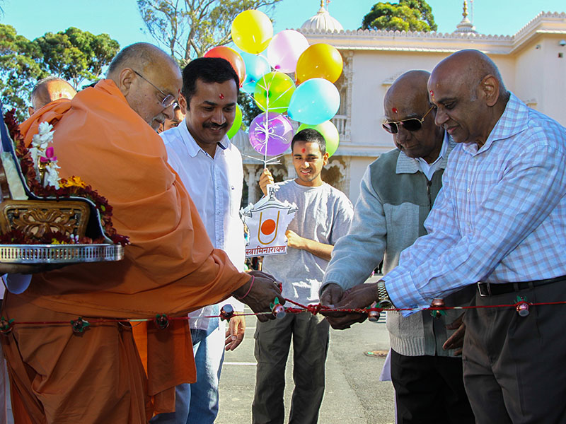 Pujya Ishwarcharan Swami and devotees inaugurate the play area for children