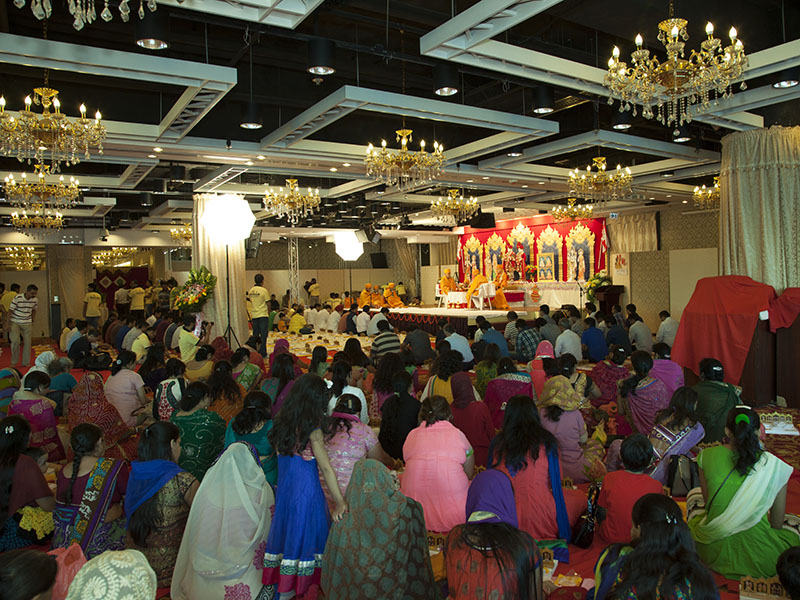 Devotees participate in mahapuja