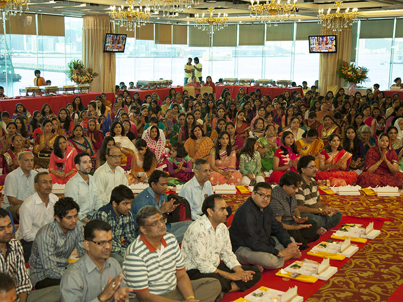 Devotees participate in mahapuja