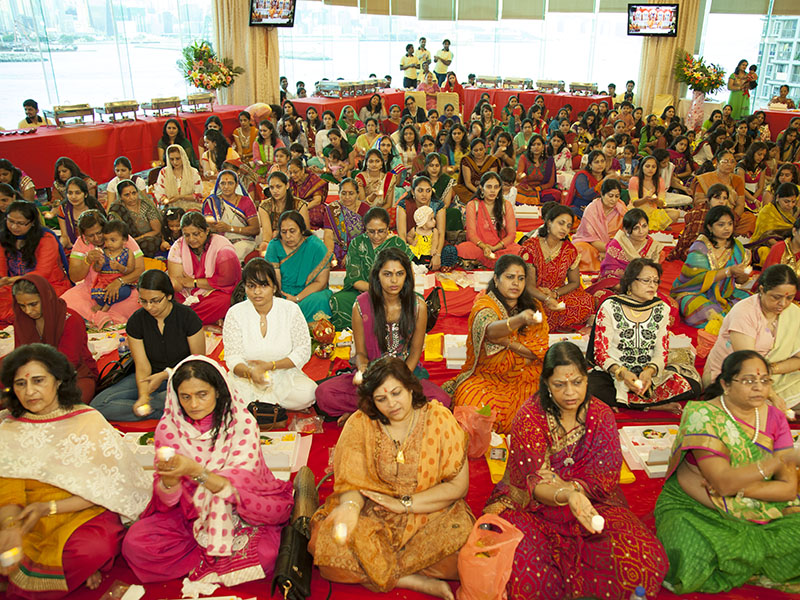 Devotees participate in mahapuja
